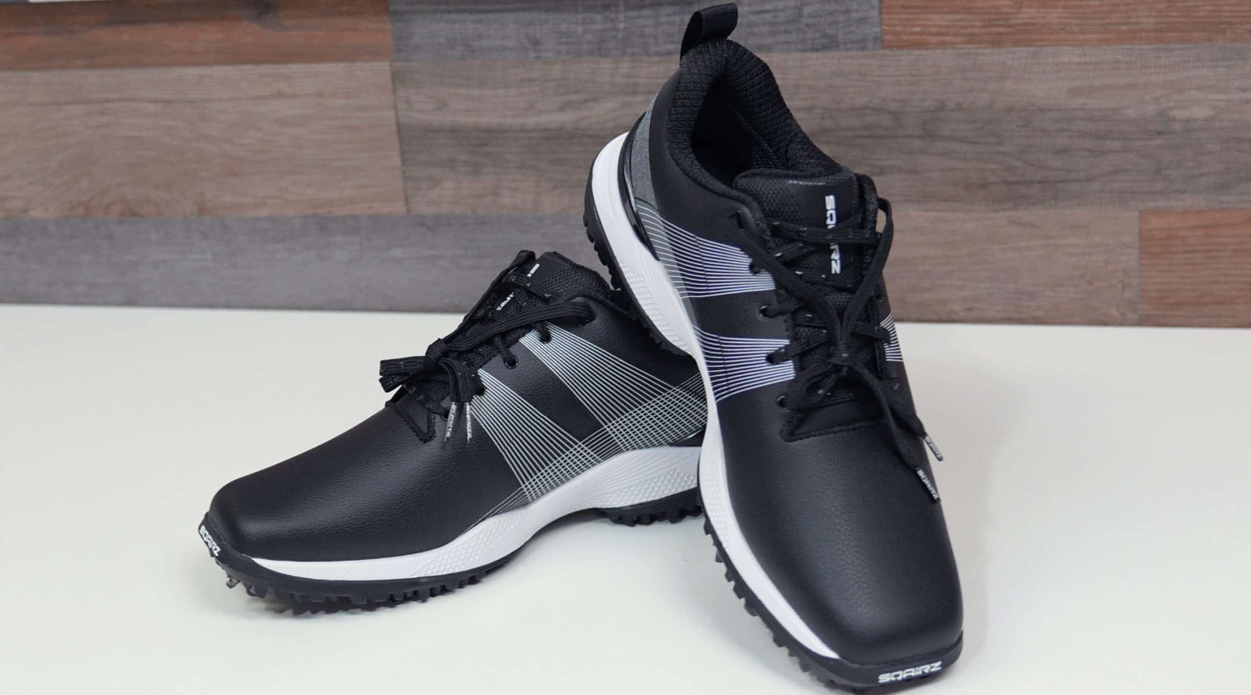 Black and white athletic golf shoes