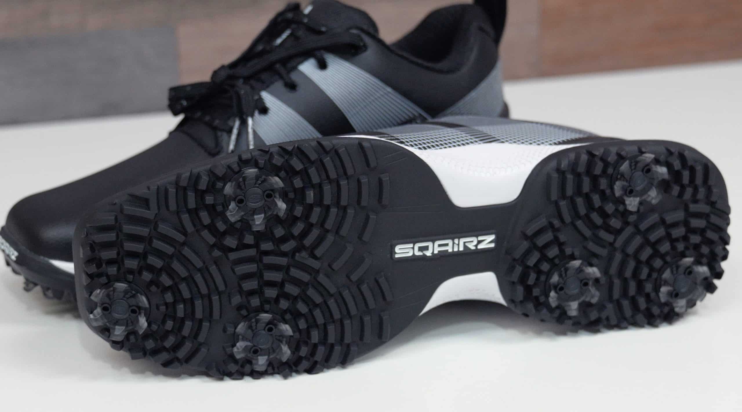 Black and gray Sqairz golf shoes with spikes