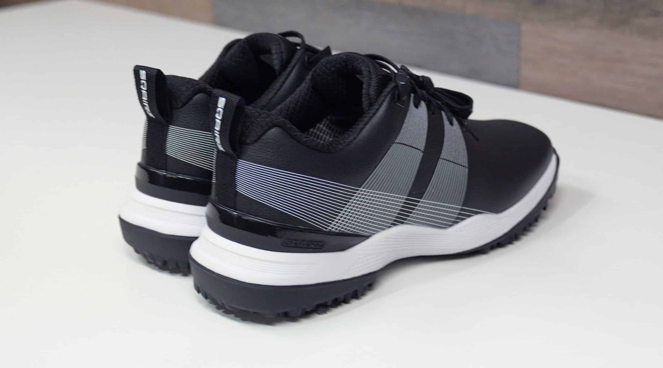 Black and white athletic shoes on table