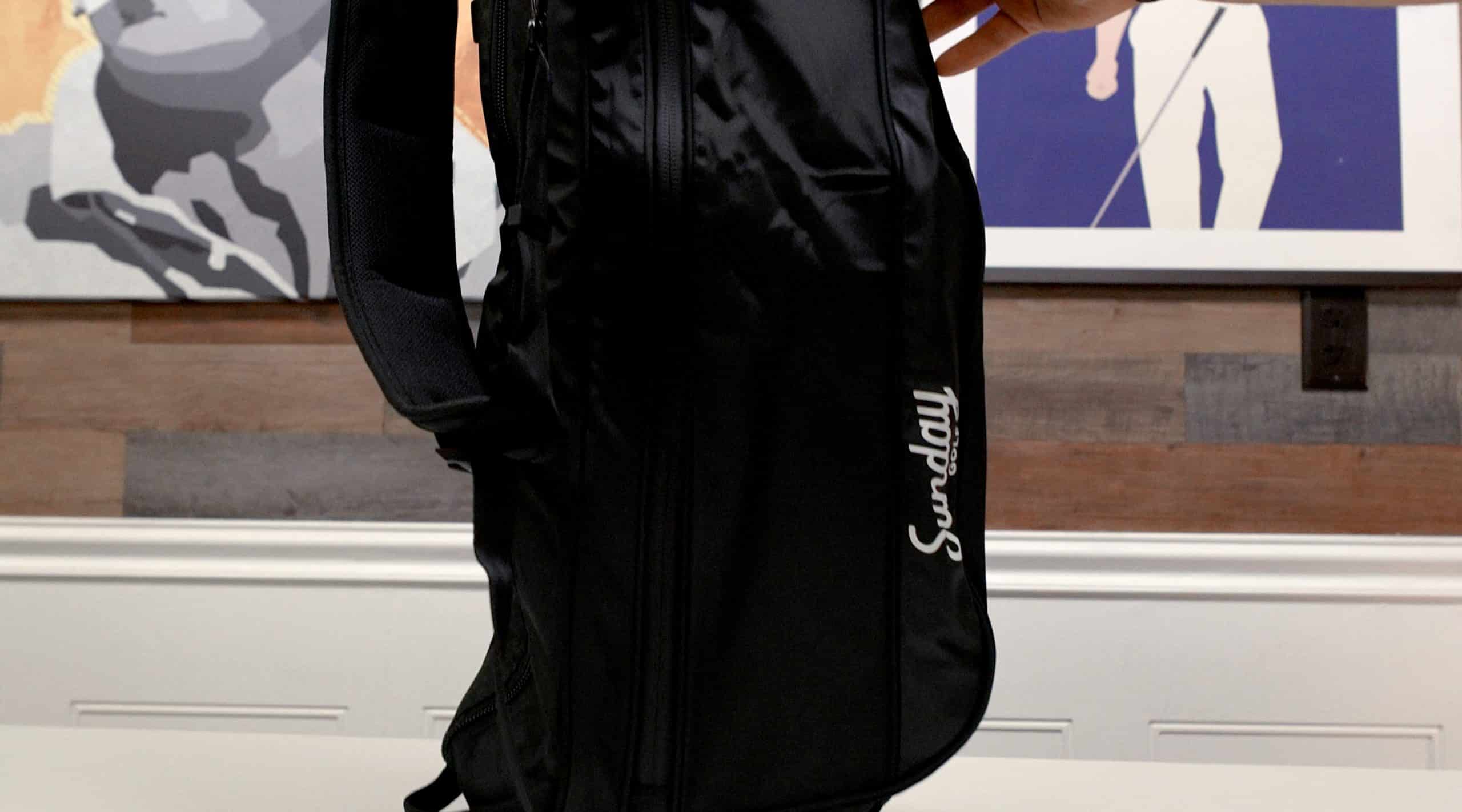 Black Sunday golf bag on indoor table