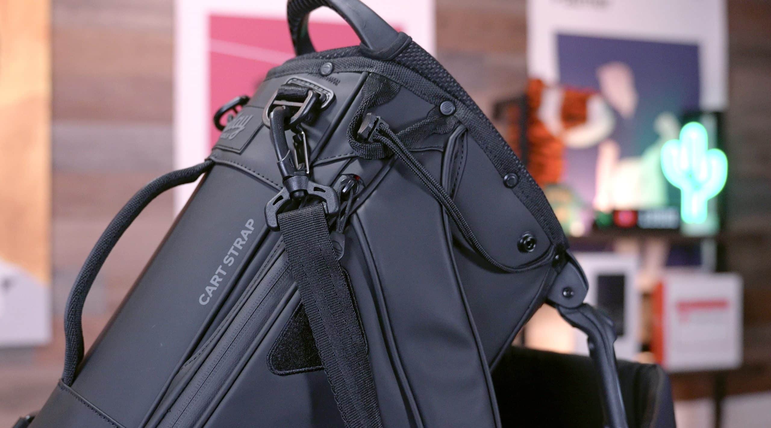 Black golf bag with cart strap