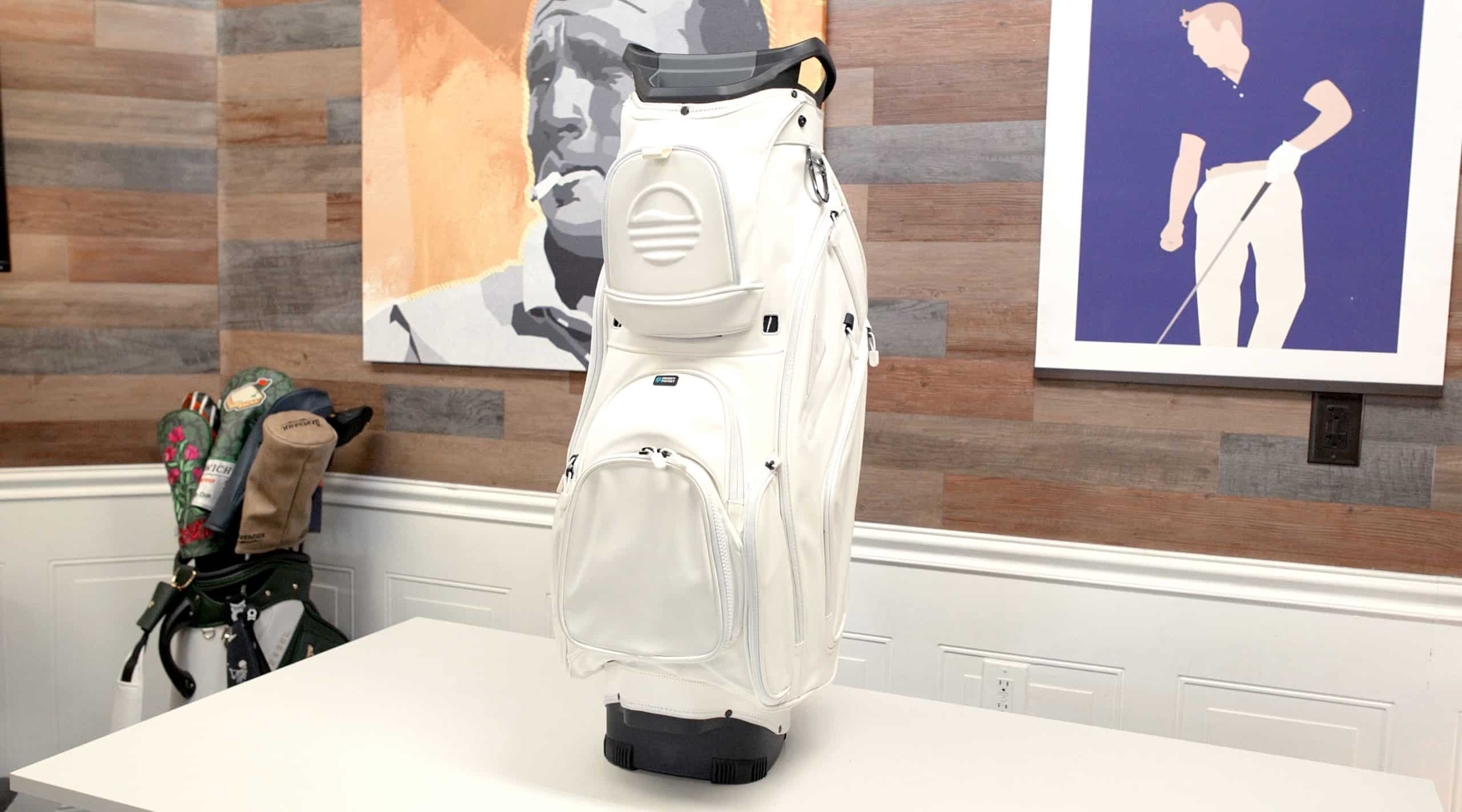 White golf bag on table indoors