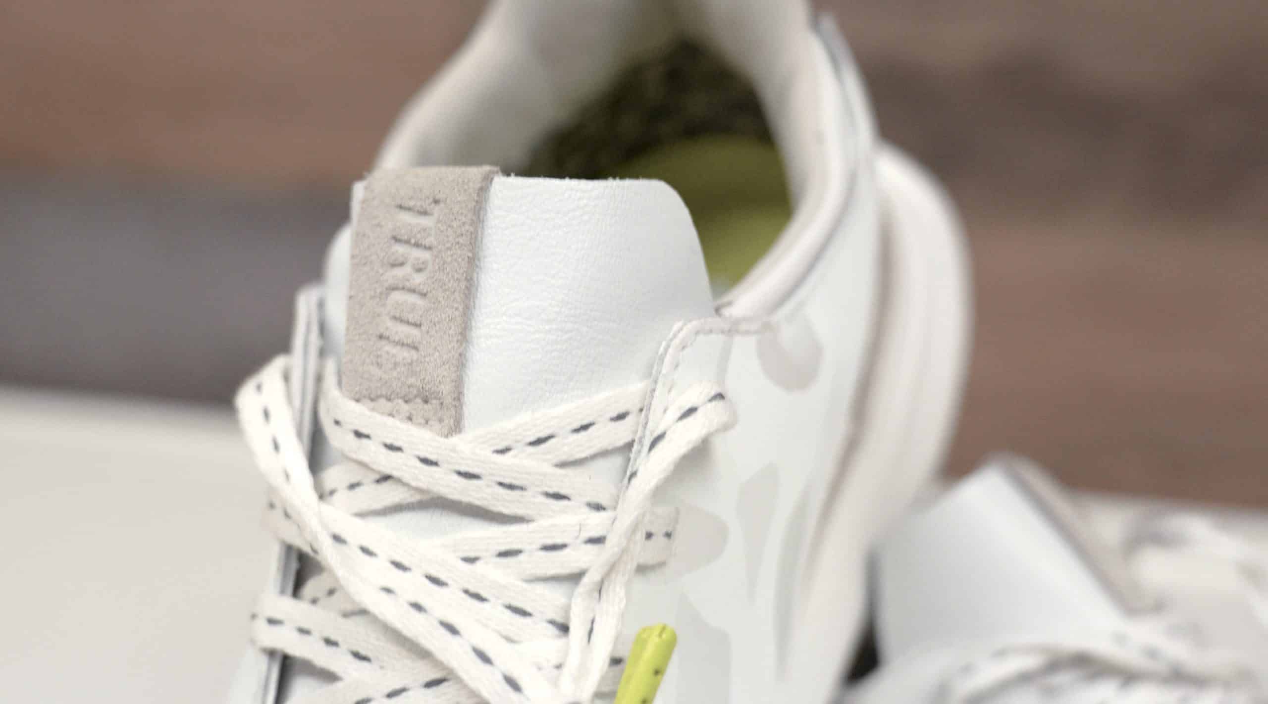 White leather sneaker with patterned laces