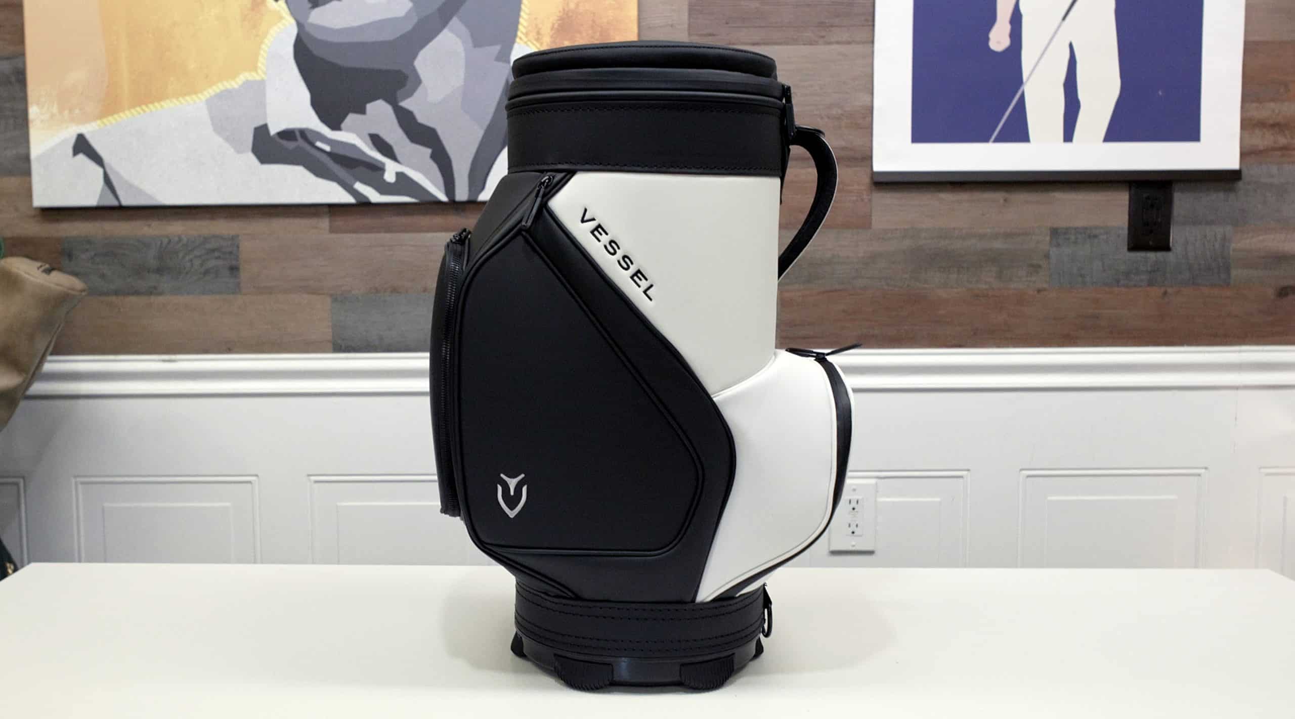 Black and white Vessel golf bag on table