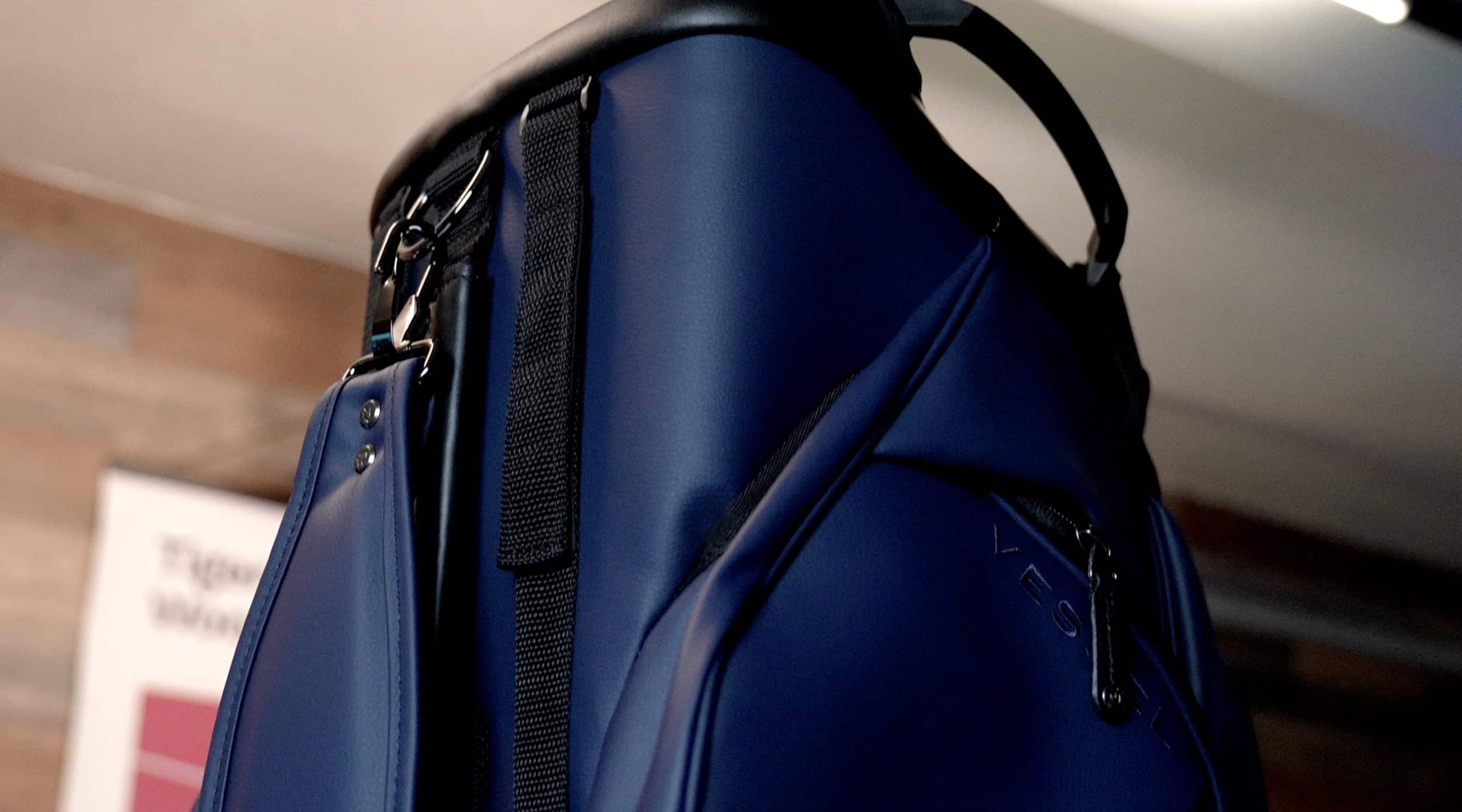 Close-up of blue golf bag with black strap