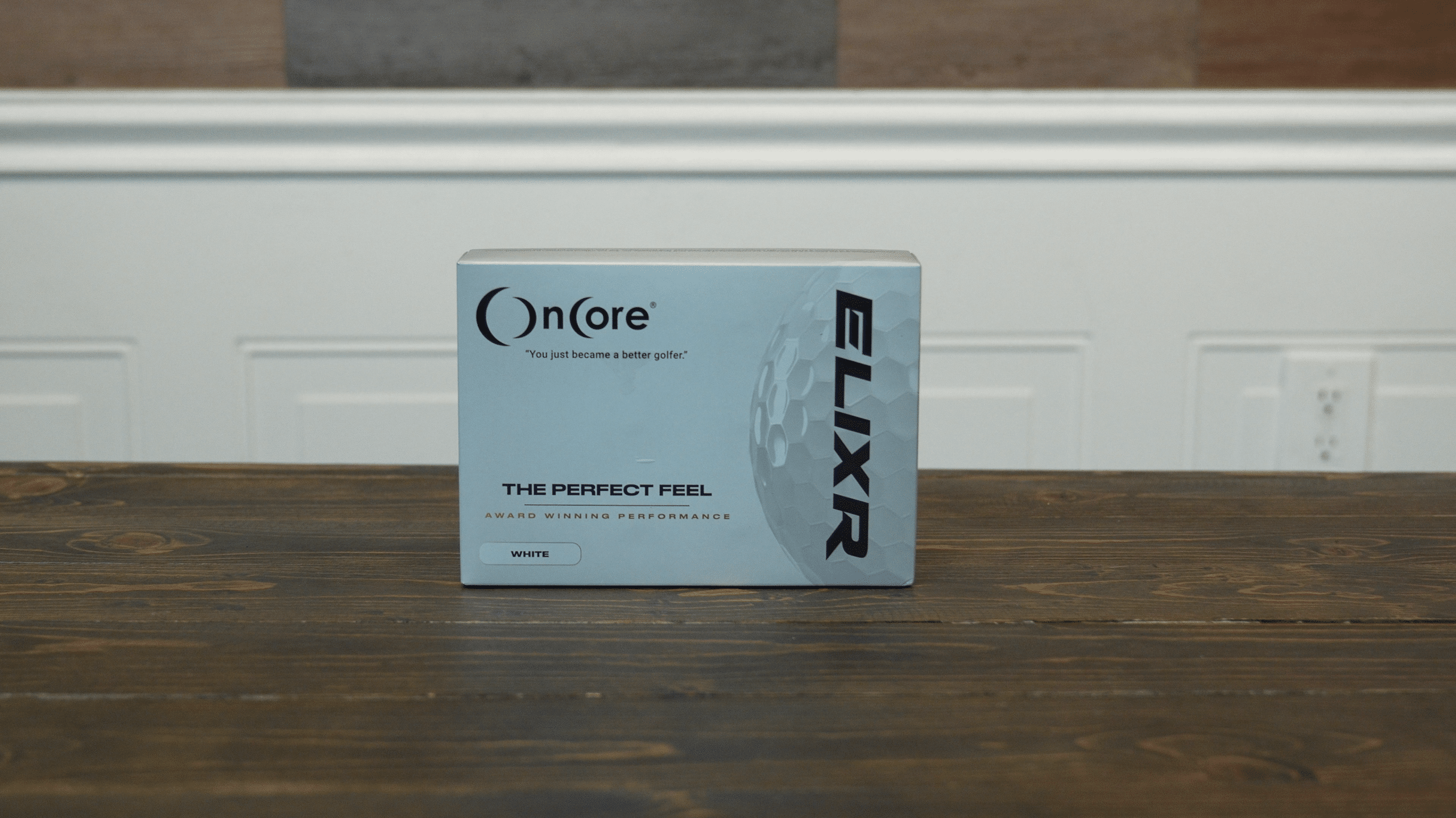 OnCore ELIXR golf ball box on table