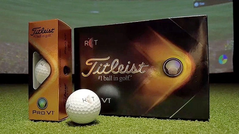 Titleist Pro V1 golf balls and packaging on turf