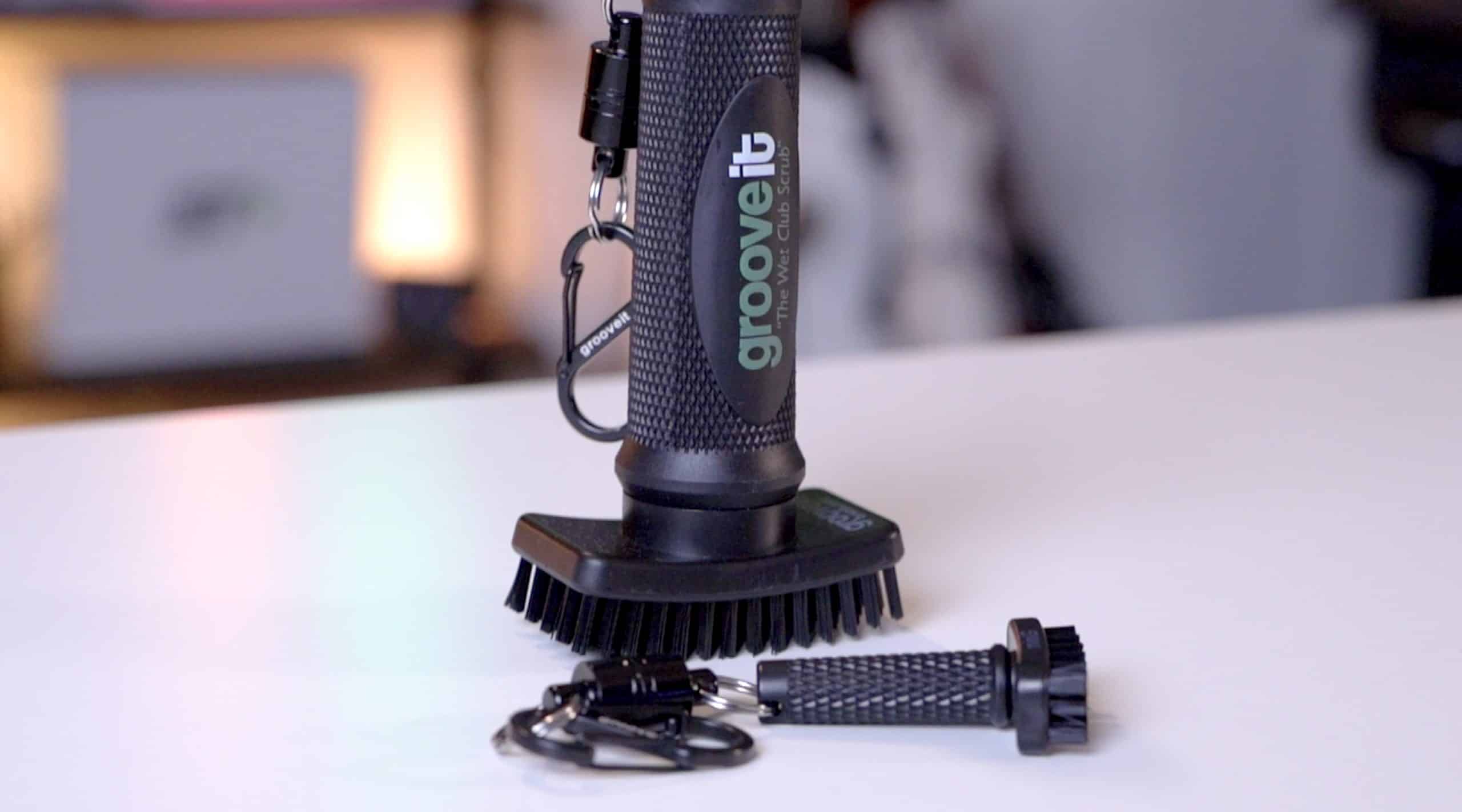 Grooveit golf club cleaning brush on table