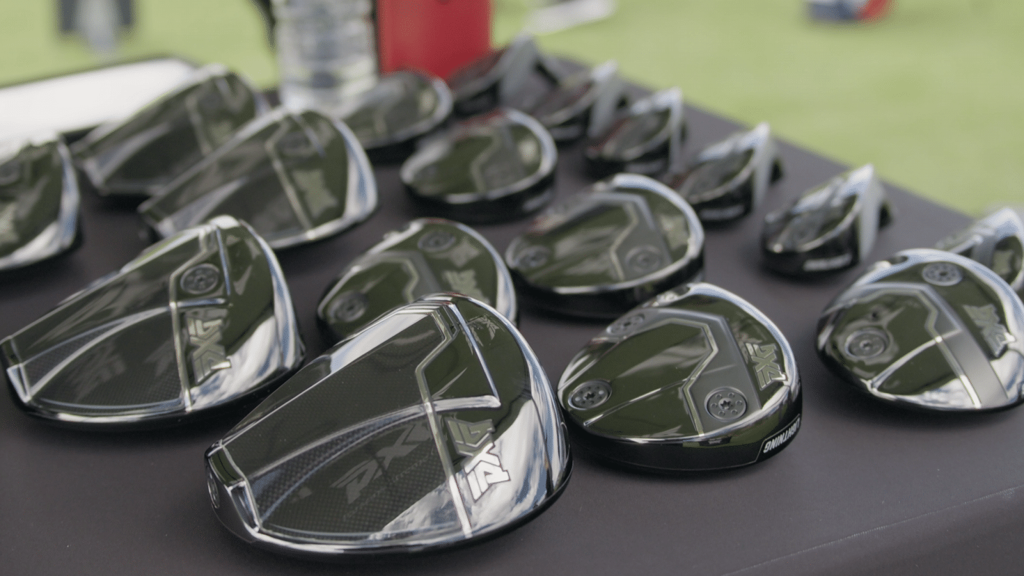 Golf club heads displayed on a table