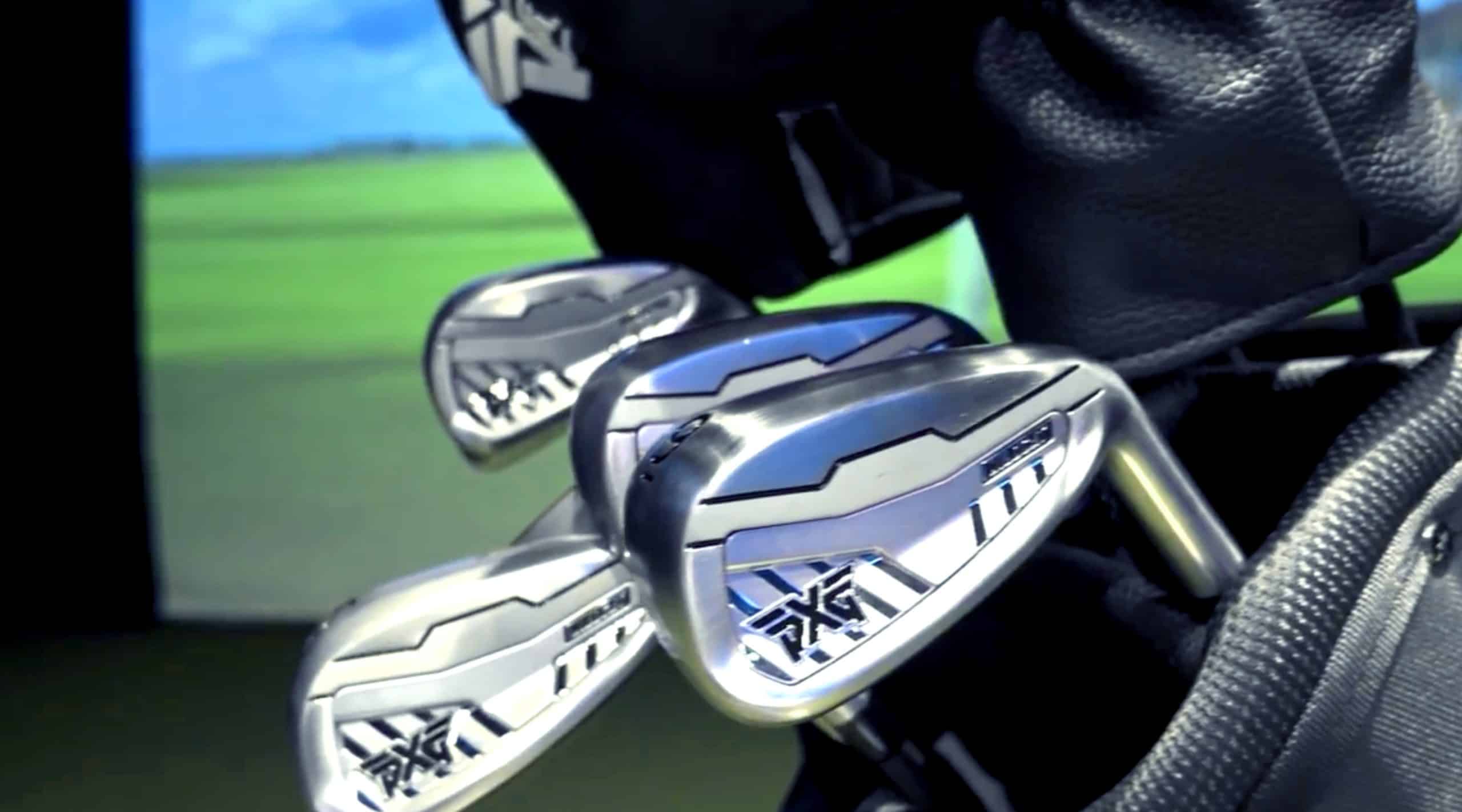 Shiny golf clubs in a black golf bag