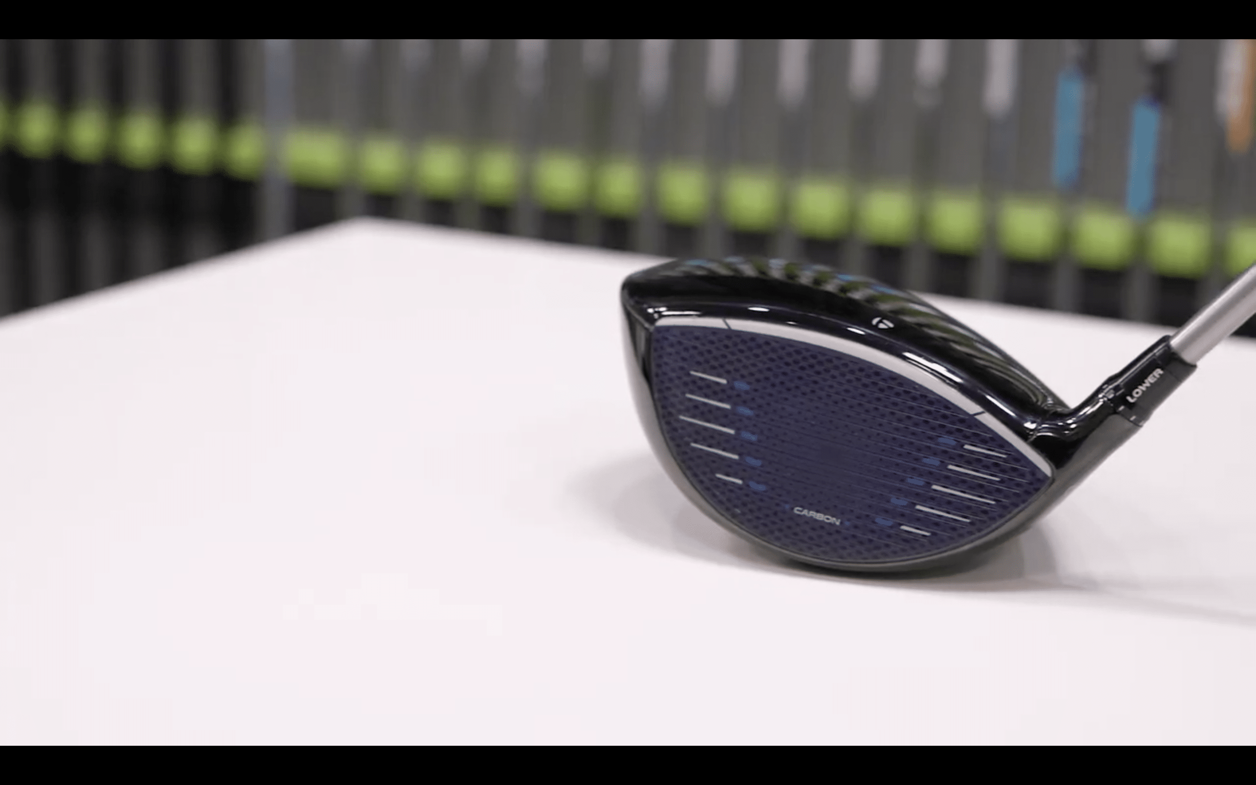 Modern golf driver club on display table