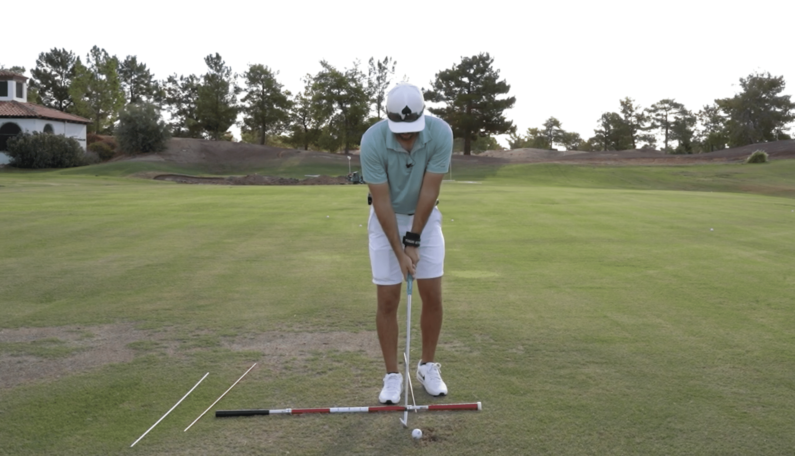 Golfer practicing putting on green