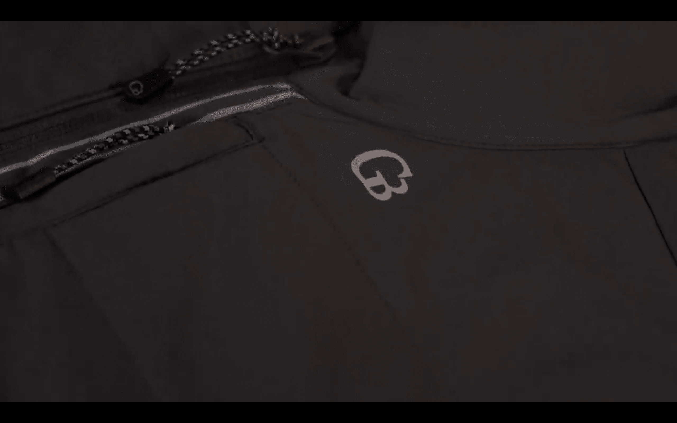 Gray jacket with zipper and logo detail