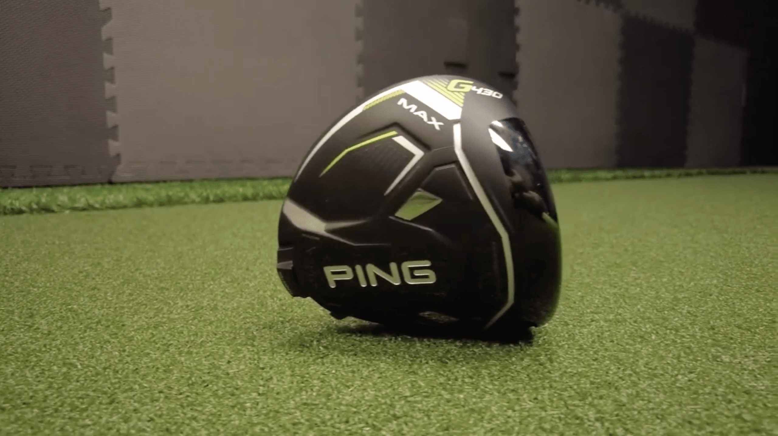 Ping G430 Max golf driver on turf