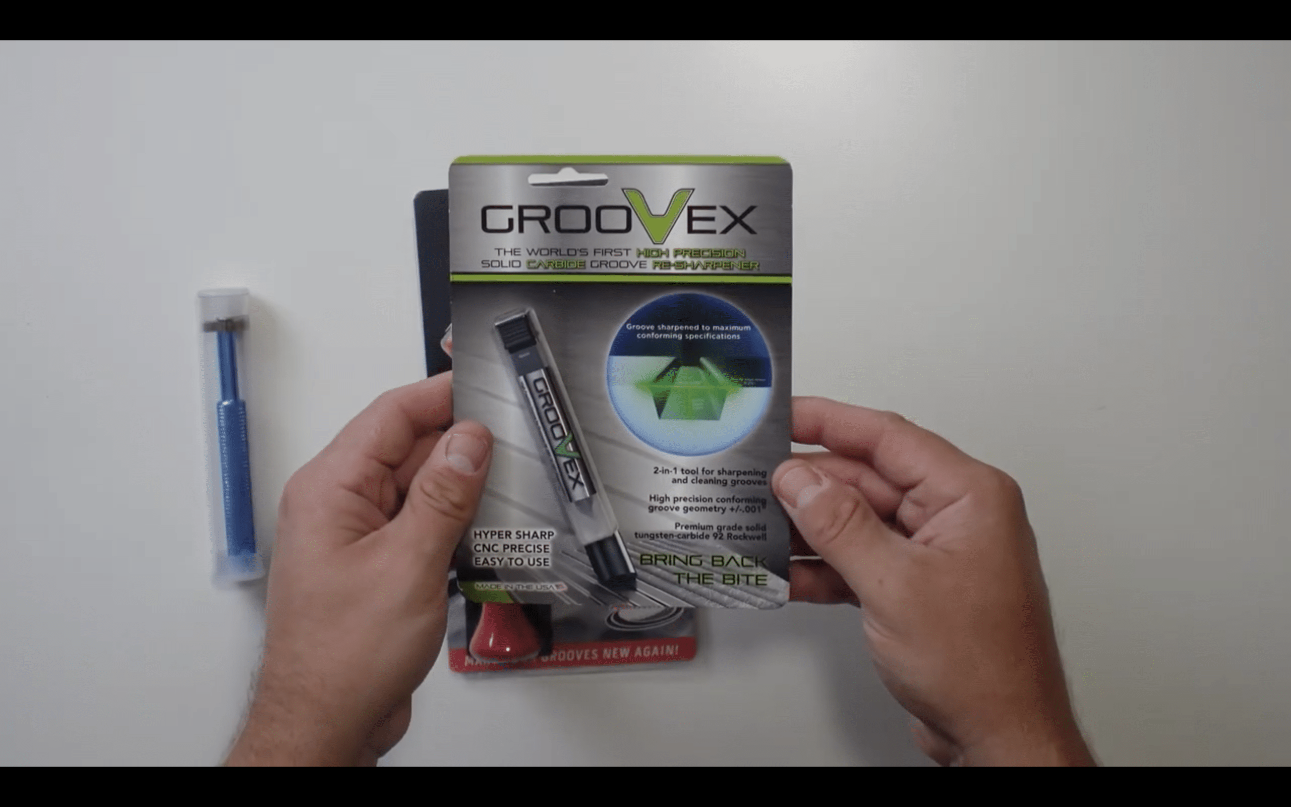 Person holding Groovex precision groove sharpener package