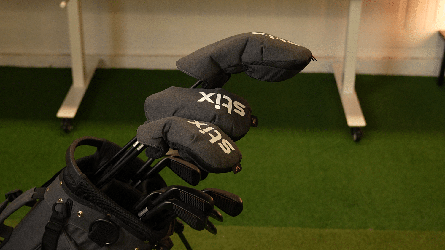 Golf clubs with headcovers in a bag