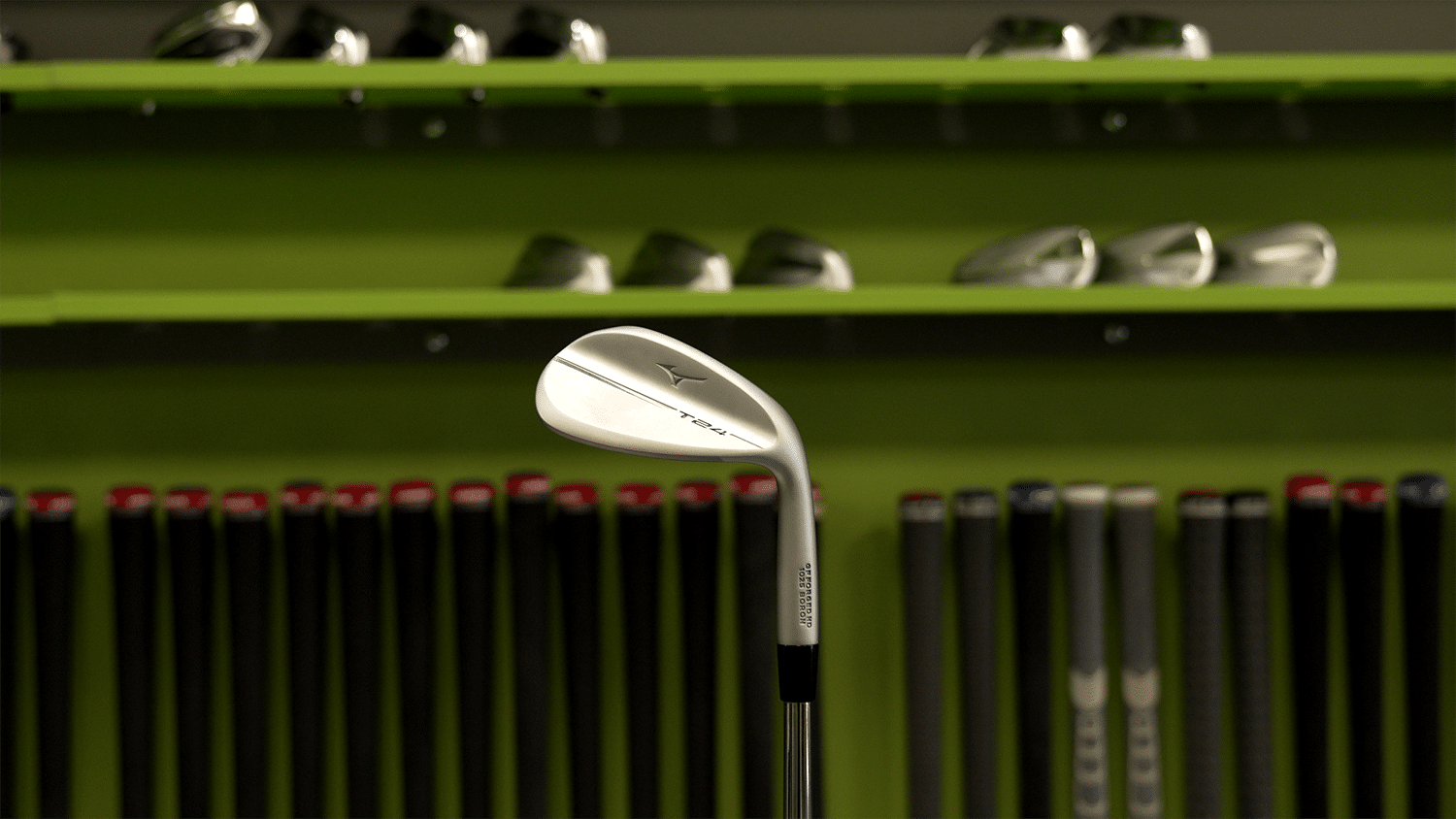 Silver golf wedge displayed with golf clubs background