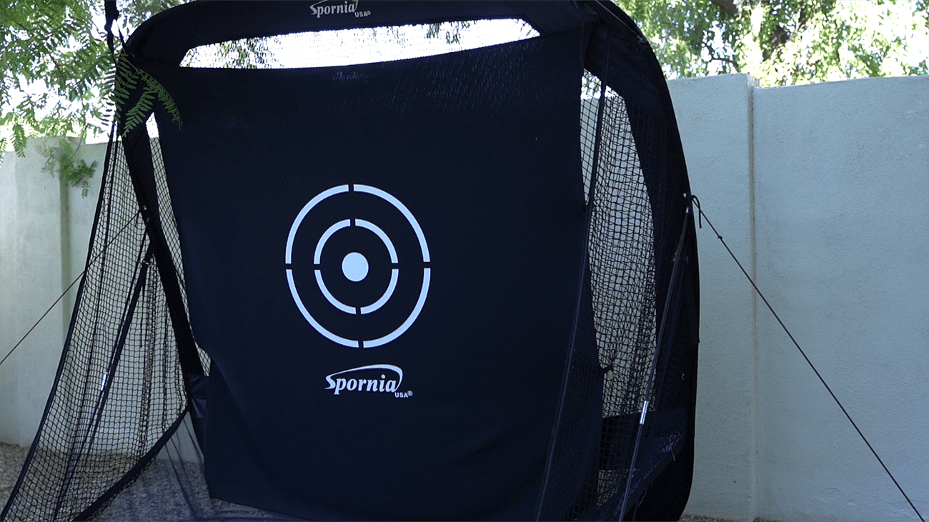 Golf practice net with target outdoors