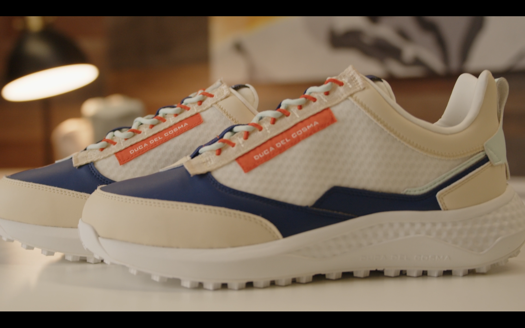 Stylish beige and blue sneakers on display