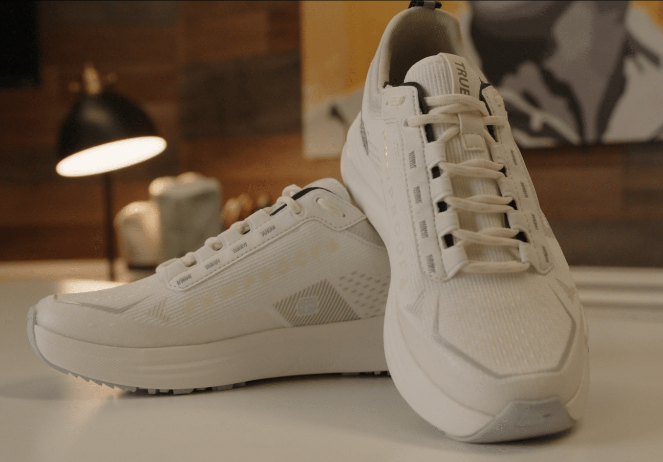 White athletic sneakers on a table indoors