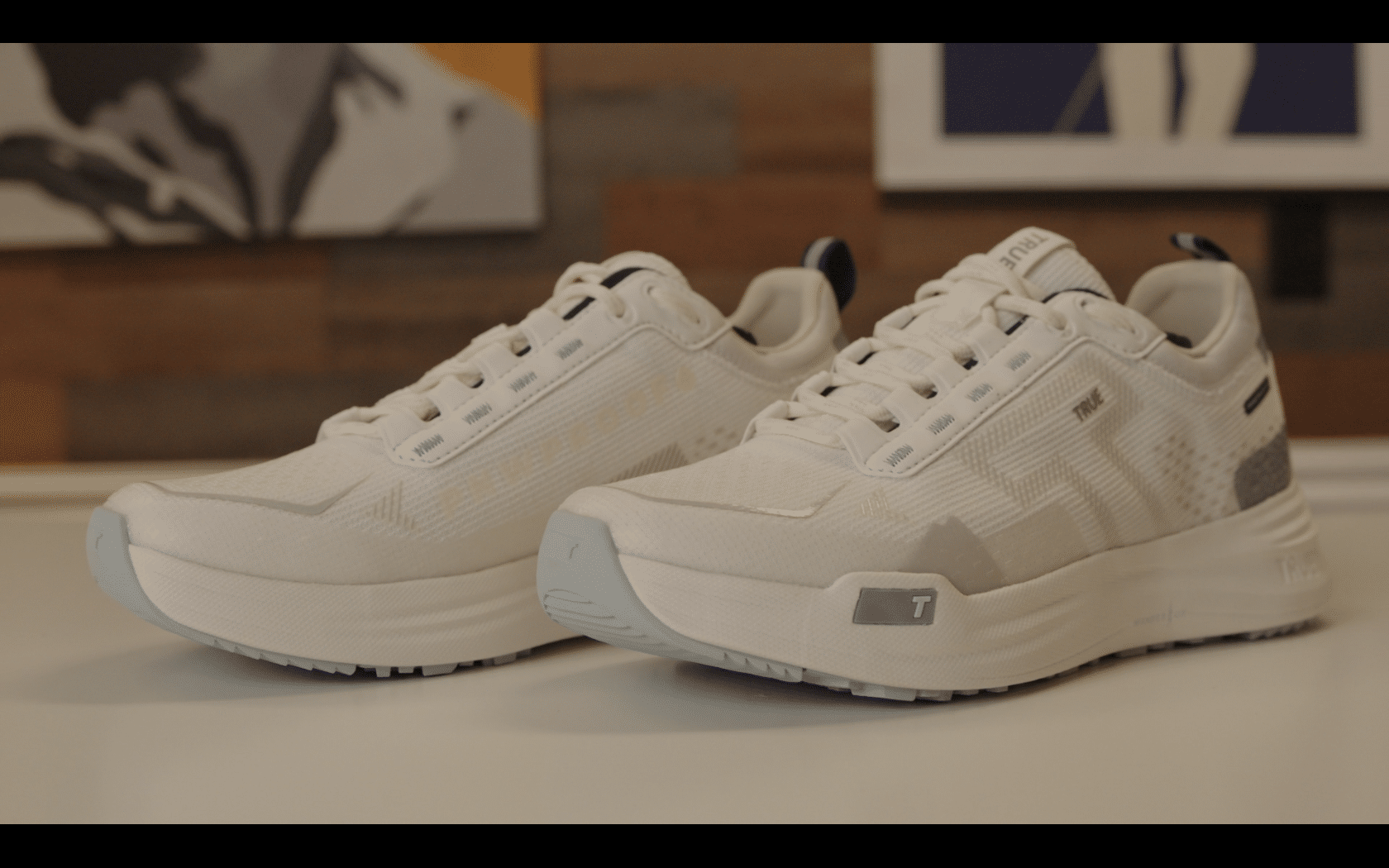 White athletic running shoes on display table