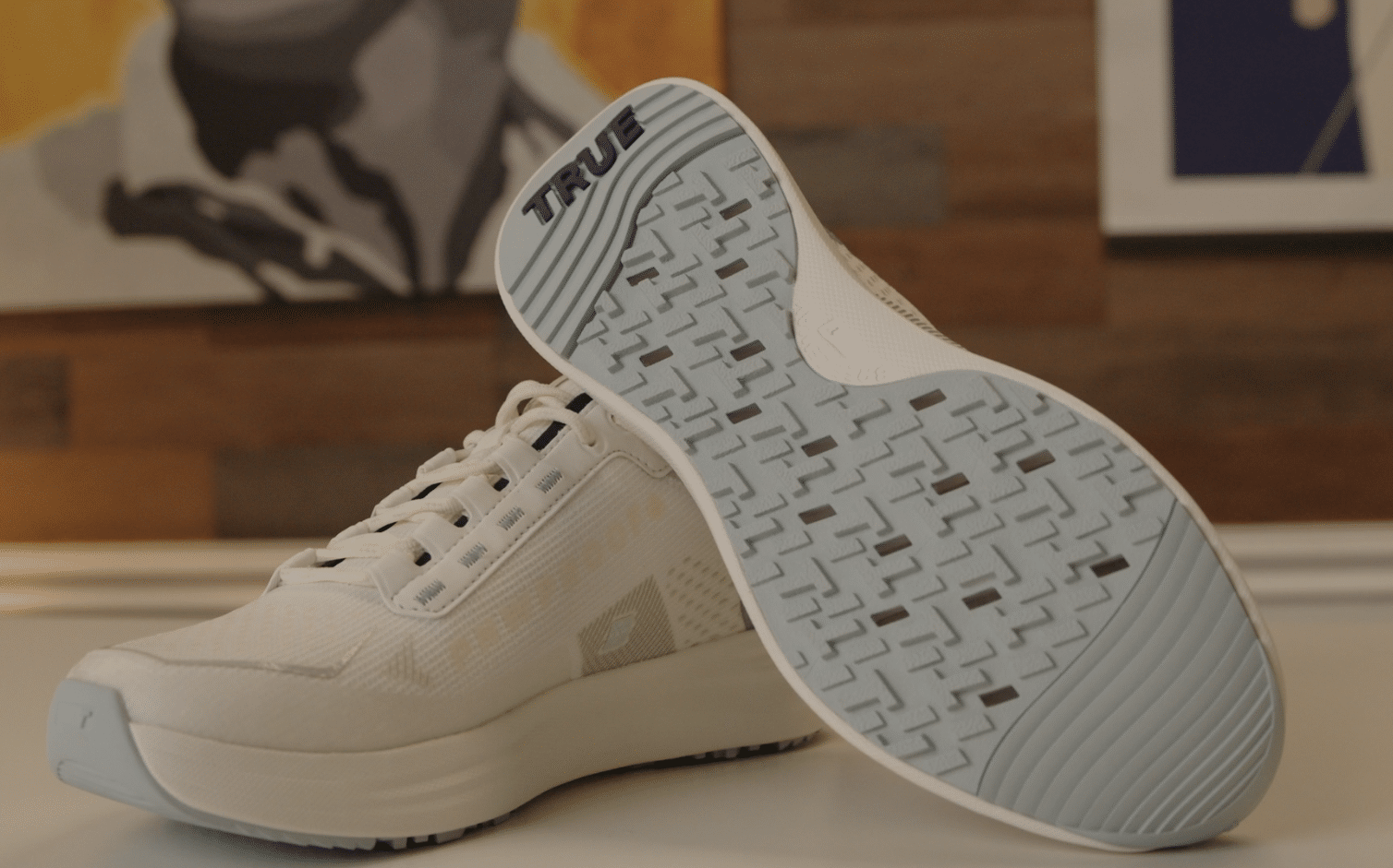 White athletic shoes with textured blue soles