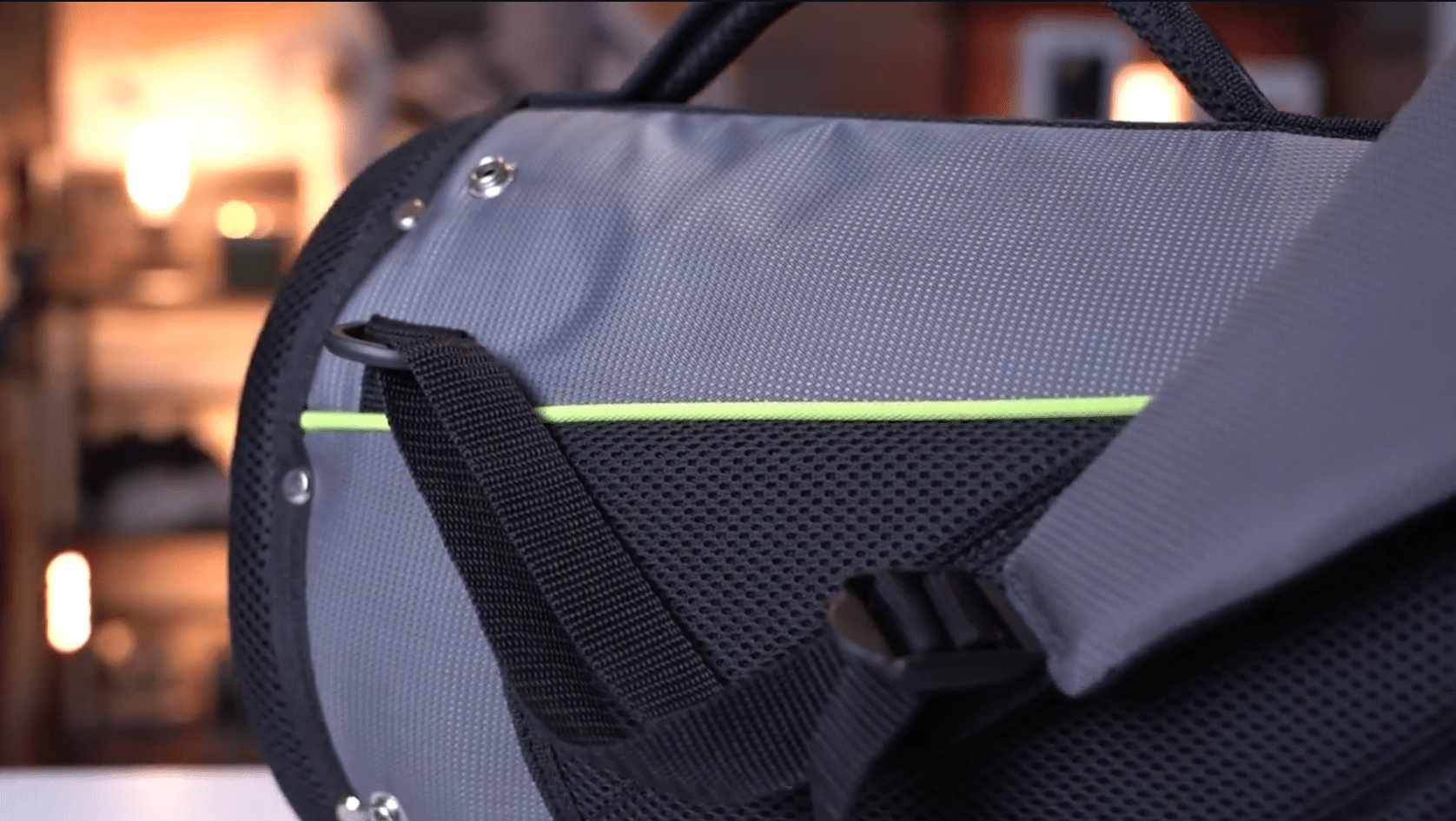 Close-up of gray duffel bag with strap