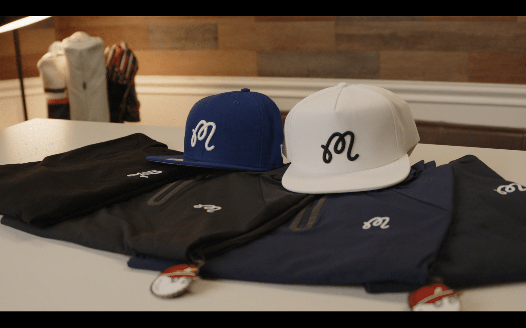 Embroidered hats and jackets on display table