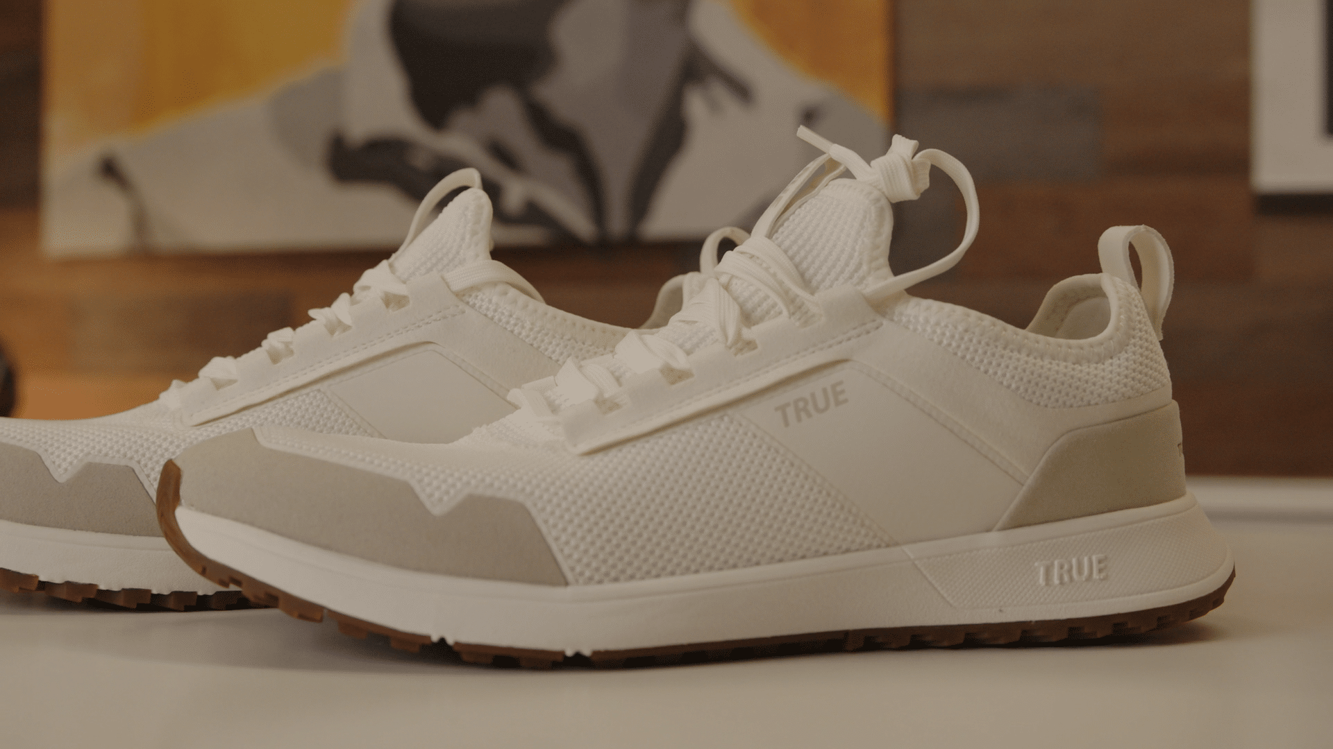 White TRUE brand athletic sneakers on display