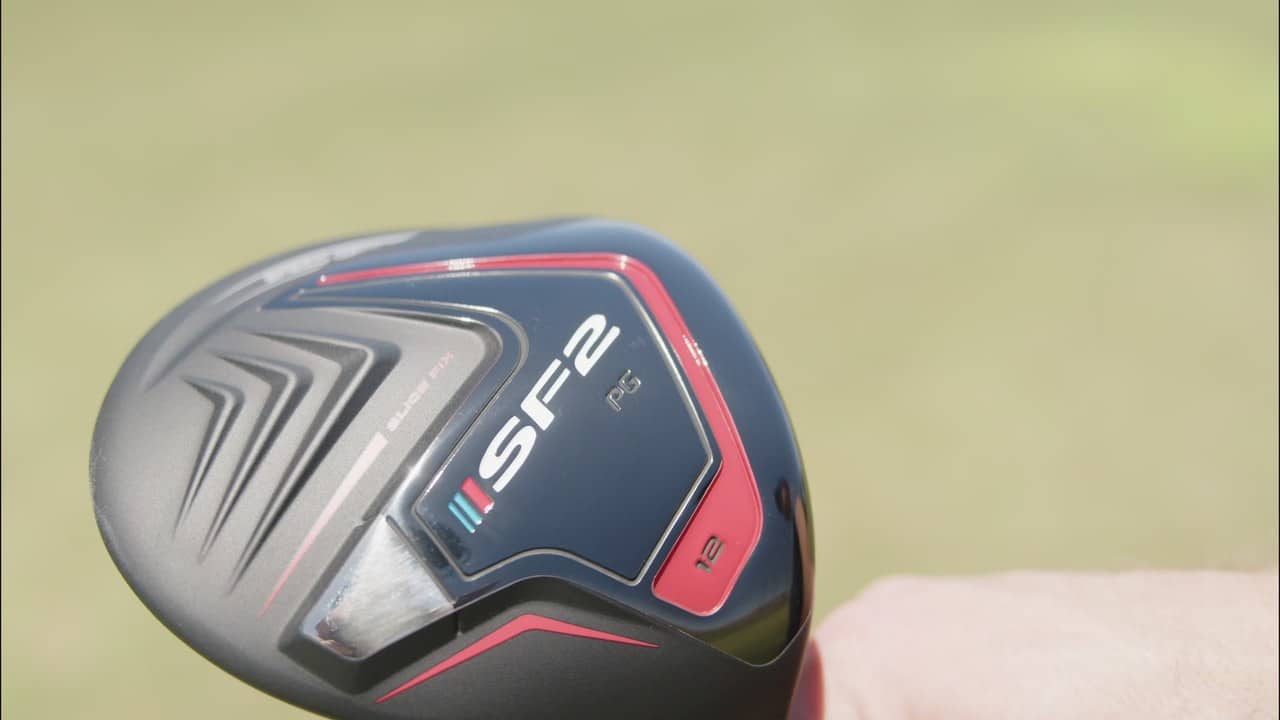 Close-up of the Performance Golf SF2 driver sole outdoors with grass in the background, showing the loft marking and SF2 branding