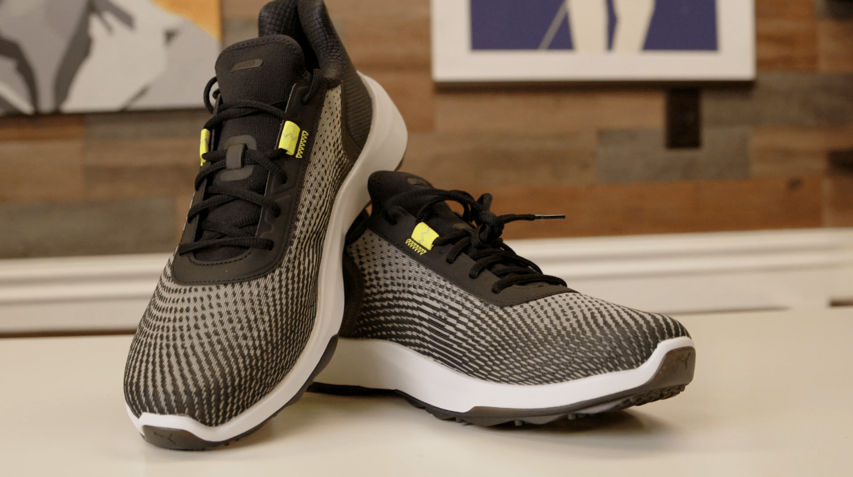 Black and white athletic sneakers with neon accents