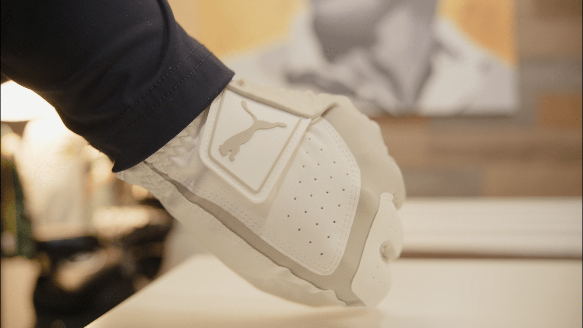 Close-up of white Puma sneaker heel