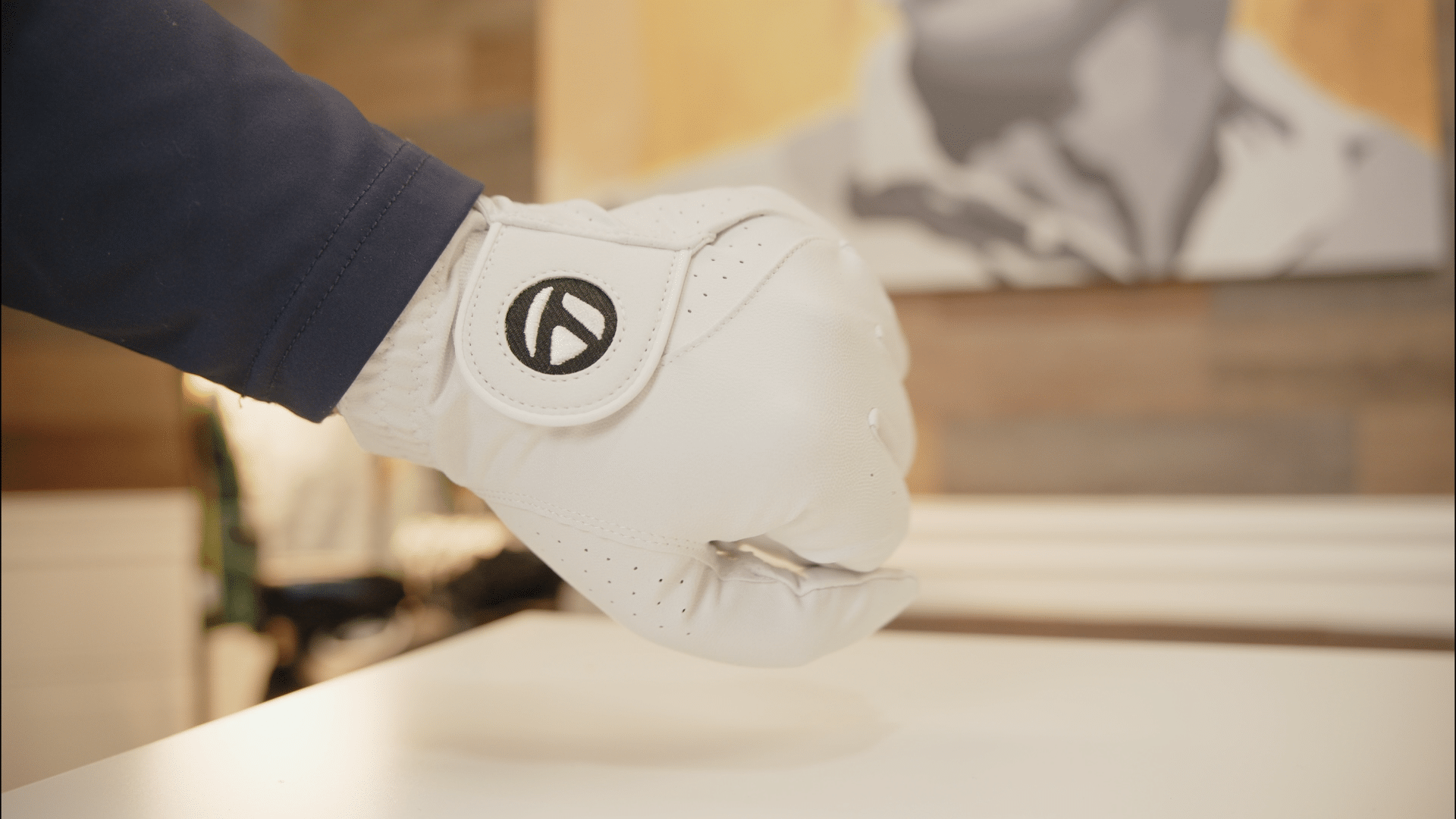 Close-up of hand wearing white golf glove