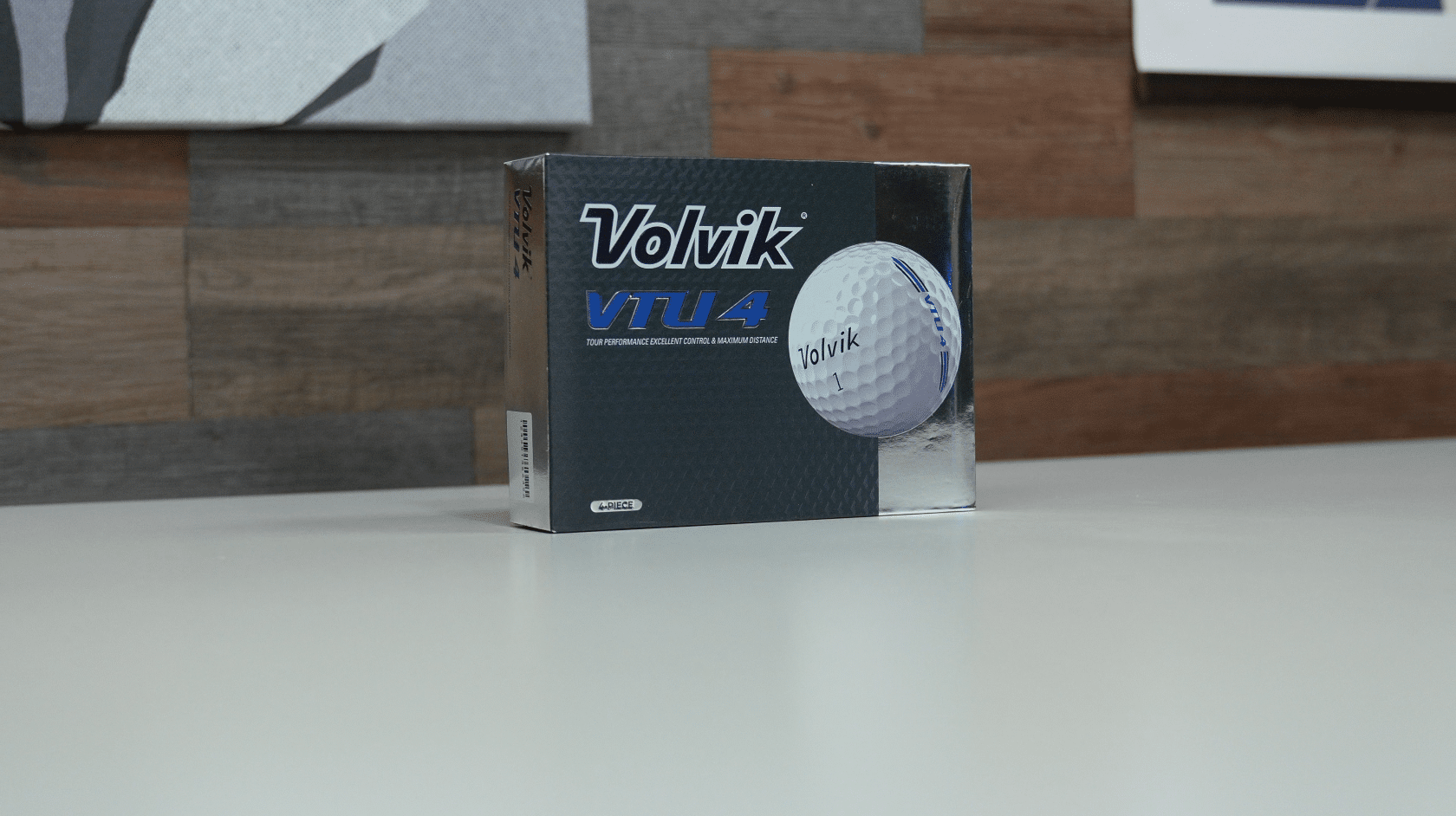 Box of Volvik VTU4 golf balls on table
