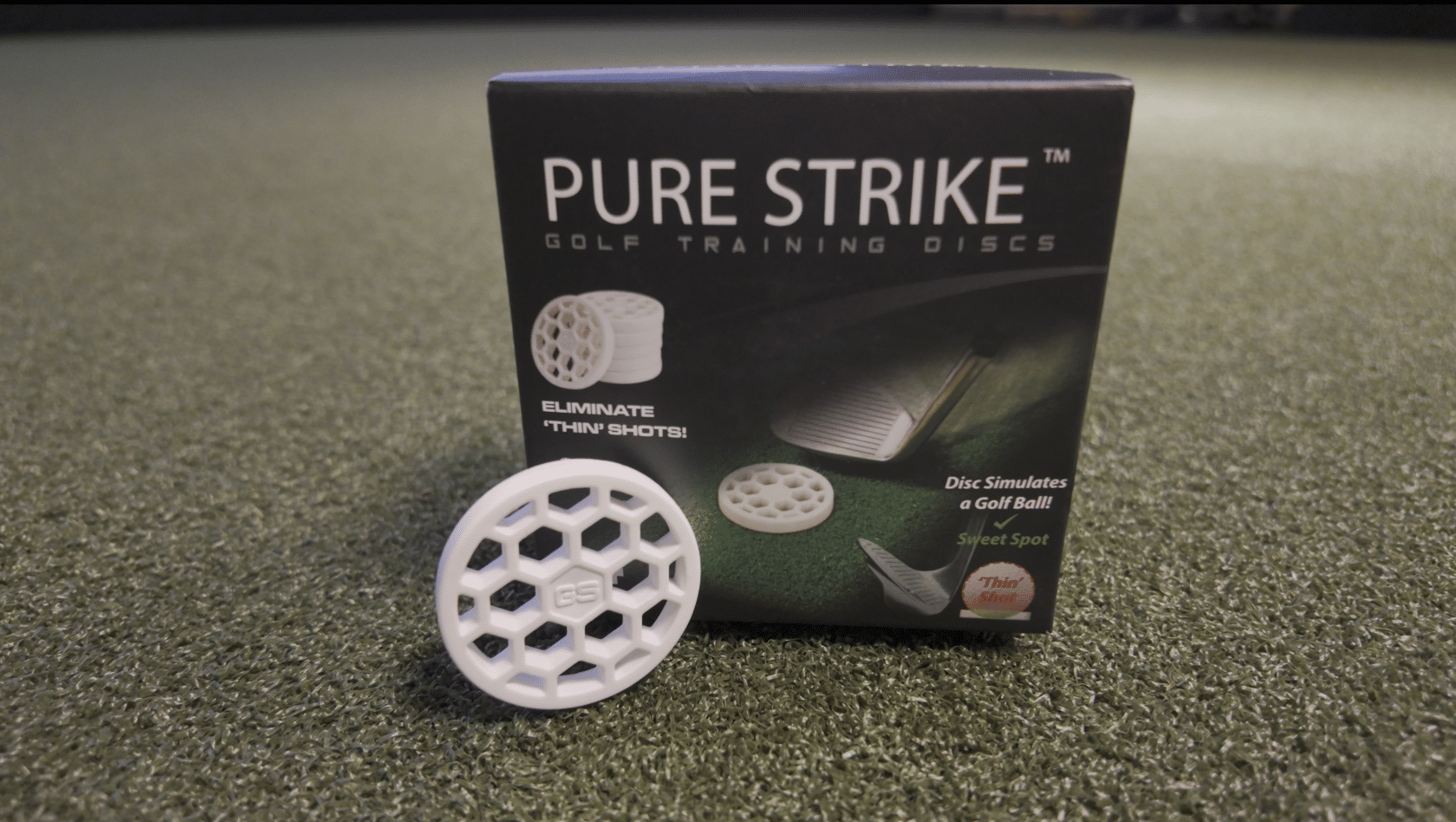 Pure Strike golf training discs on artificial turf