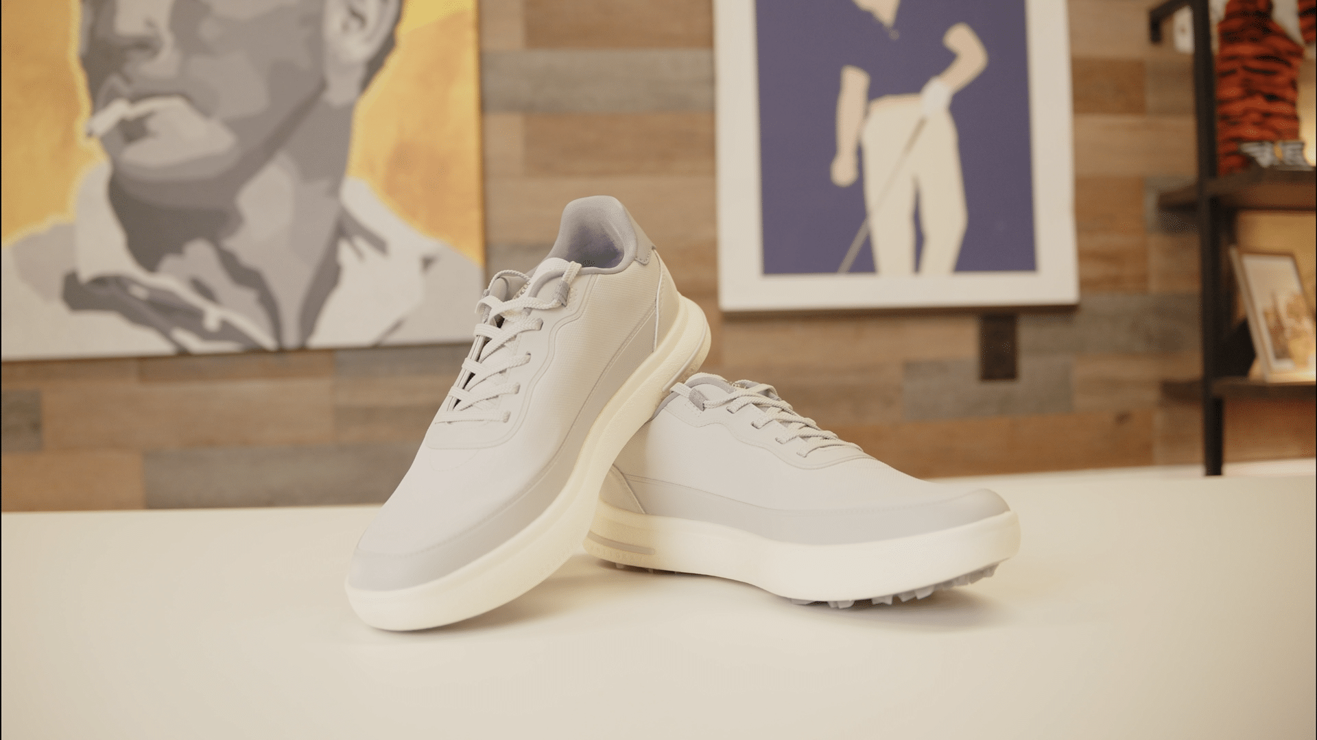 White athletic sneakers displayed on a table