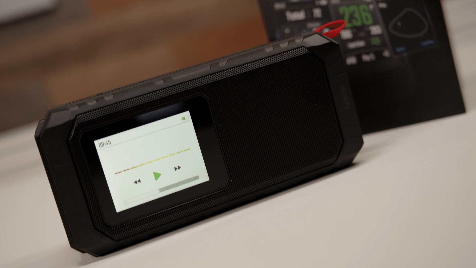 Portable black speaker with touchscreen music controls
